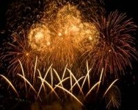 The fireworks explode high in the sky