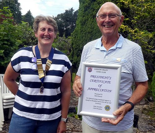 Retiring Secretary, Bob Prevost, receiving a Certificate of Appreciation