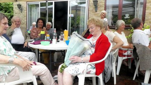 Pat Fowler, widow of our founding member David, receives a bouquet.