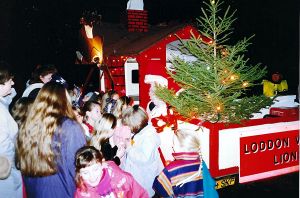 Children thronging the Christmas Float in 1990