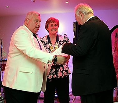 Barry Germain (R) receives his 30 year Service Award from District Governor David